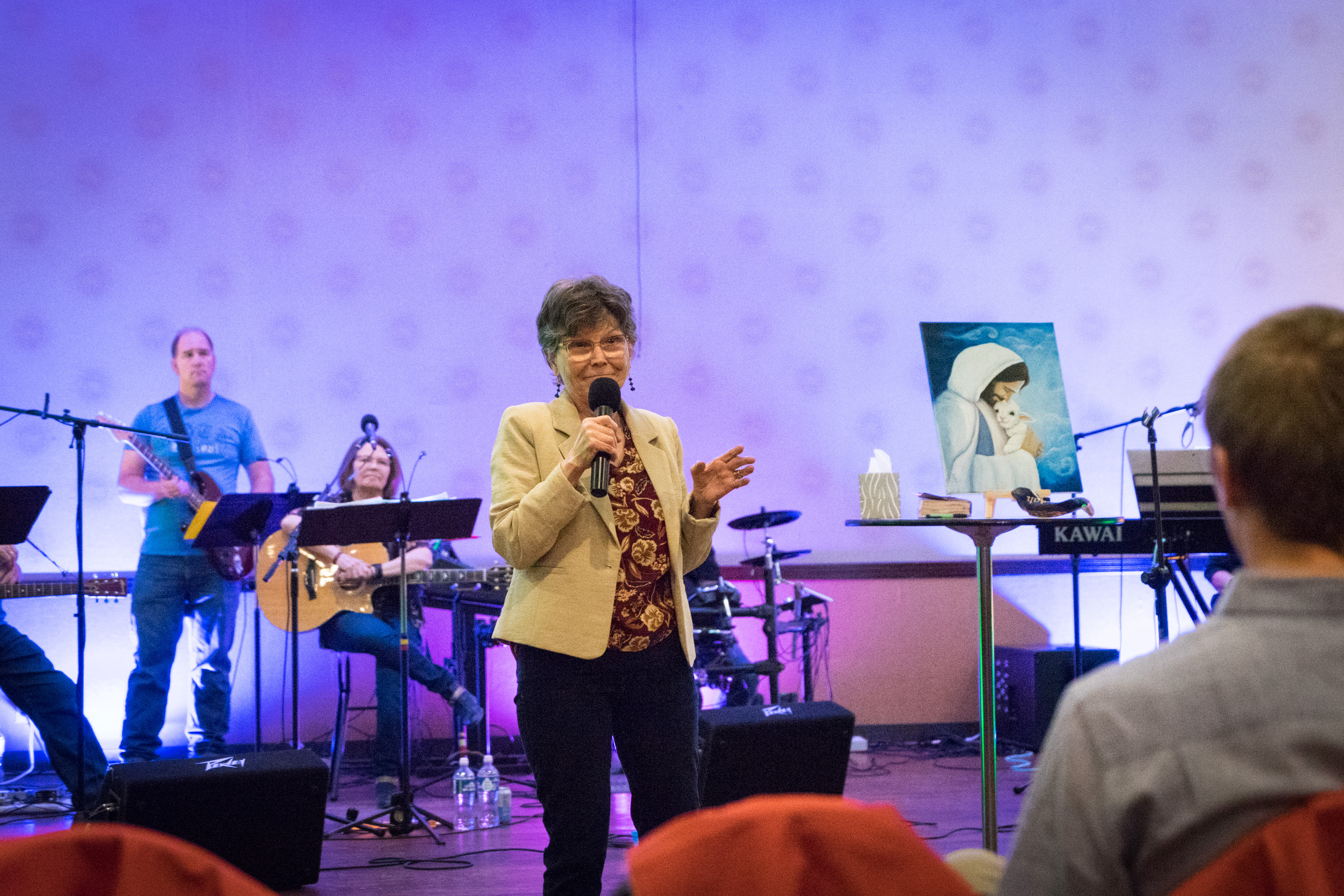 Linda Lentner ministering with the band — the fire of God in worship